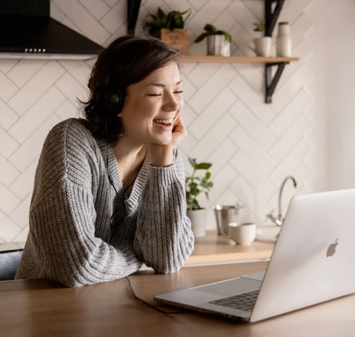 a young white woman on video call on her mac desktop